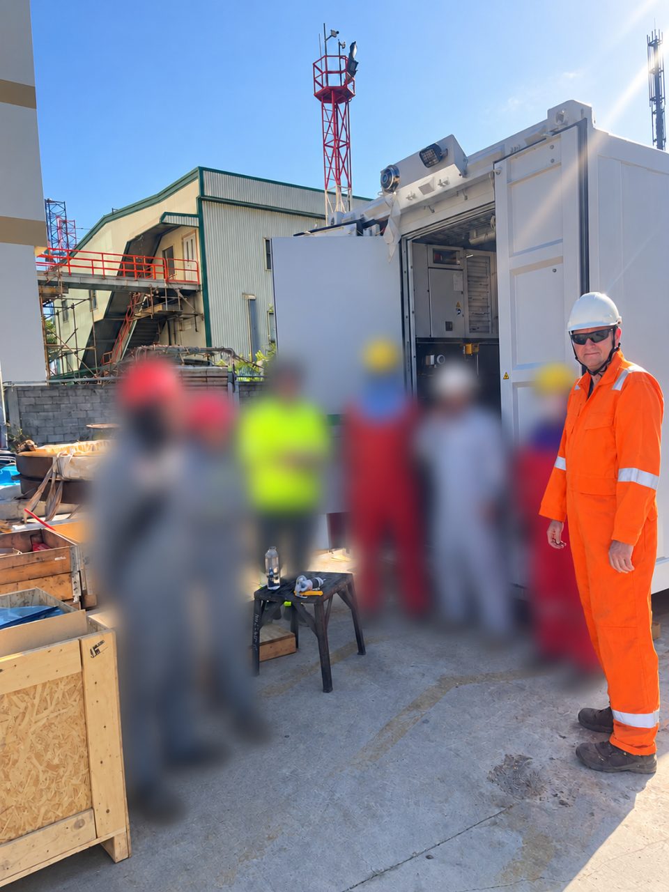 Mads Kylling with the site team at an offshore defence container in Vũng Tàu, Vietnam